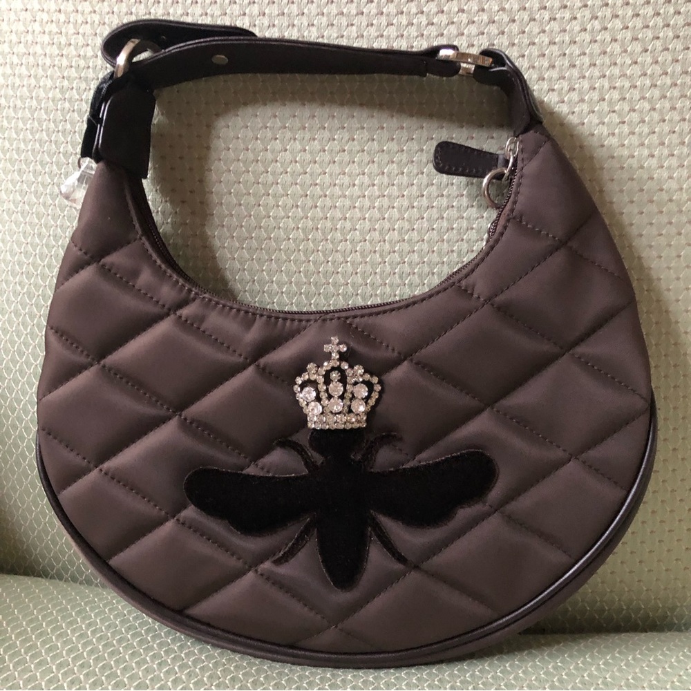 Chocolate brown quilted My Flat in London purse.